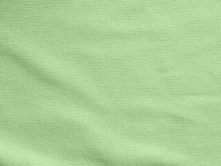 Factory textile fabric material surface green colored background with thread