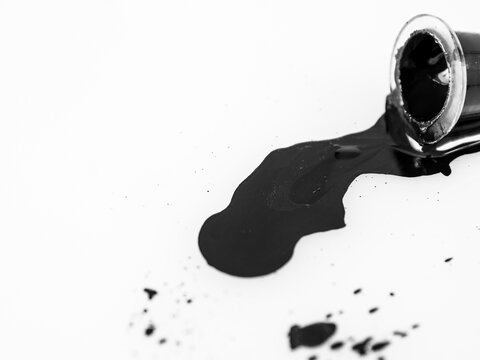 A jar with spilled red paint, paint background, pigments, ink for tattooing