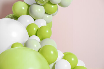 Balloon garland on beige background. Festive decor © New Africa
