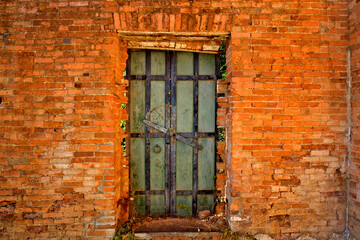 
Merchant door, brick wall with sinking lentil in Shasta, California an old gold mining town from the 1850’s