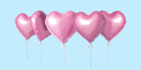 Bunch of pink color heart shaped foil balloons isolated on bright background. Minimal love concept.
