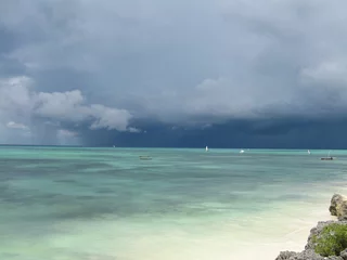 Cercles muraux Plage de Nungwi, Tanzanie Breathtaking view from Nungwi beach, Zanzibar, Tanzania, of Indian Ocean on a stormy day