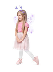 Cute little girl in fairy costume with violet wings on white background