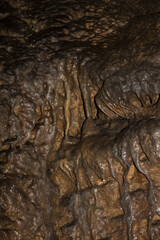 Speleology. The Bacho Kiro cave, Dryanovo, Bulgaria. Stalactite, and stalagmite speleothem formations.