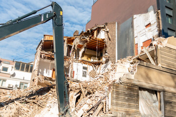 Freeing up space for construction of new building.Process of demolition of old building...