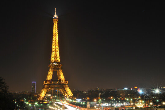 Paris, France, 08 March 2014 - View of the Eiffel Tower with night illumination. Long exposure photos and views of the city lights for a magical atmosphere.