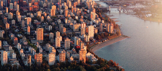 Aerial view of Stanley Park and Downtown Vancouver, BC, Canada. Beach on West Ocean Coast.