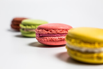 Macaron cookies on white background, delicious dessert