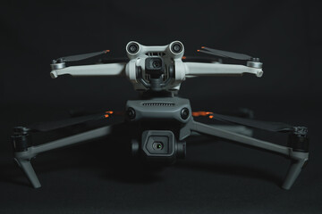 Large and small drone with cameras close-up.