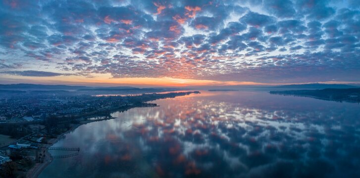 Lake Constance reflected in the morning sky, on the left the town of Radolfzell, on the horizon the Mettnau peninsula and the island of Reichenau, on the right the Hoeri peninsula, Radolfzell