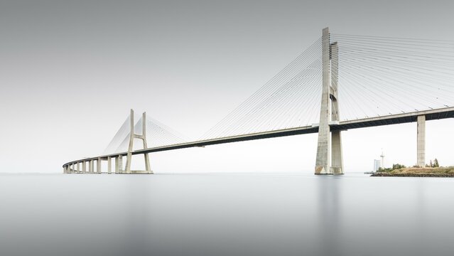 Minimalist long exposure of the famous Ponte Vasco da Gama bridge over the Tagus in Lisbon, Portugal, Europe