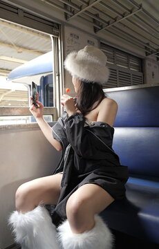 Young female train passenger takes a selfie