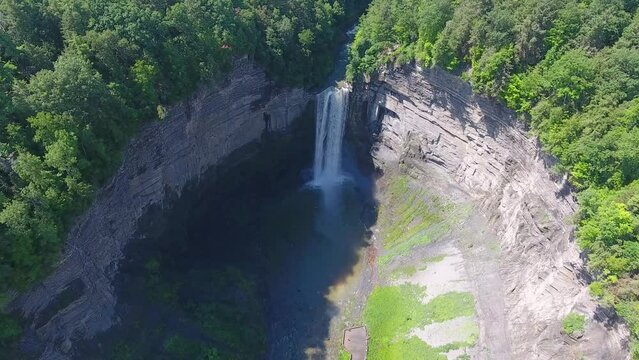 A 4K drone shot of Taughannock Falls, the tallest single-drop waterfall east of the Rocky Mountains, which leads into Cayuga Lake, located in the town of Ulysses, New York.