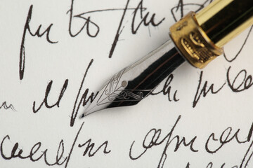 One fountain pen on handwritten letter, closeup