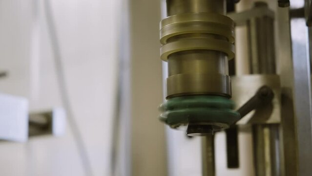 Automated shrink wrap machine in action at a wine bottling facility