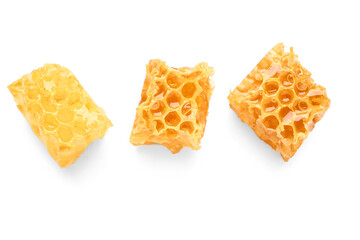 Sweet honeycombs on white background