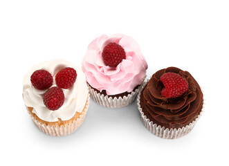 Tasty cupcakes with raspberries on white background