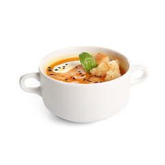 Pot of delicious pumpkin cream soup with croutons and basil on white background