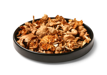 Plate with tasty dried mushrooms on white background