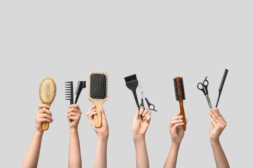 Many female hands with hair supplies on white background. - obrazy, fototapety, plakaty