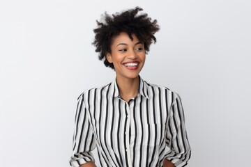 A smiling woman in a black and white striped shirt - Powered by Adobe