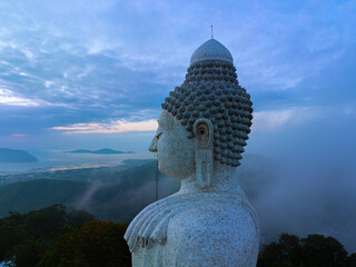 aerial photography scenery blue sky and blue ocean behind Phuket white big Buddha...Fog cover Phuket white big Buddha is the famous landmark in Phuket.