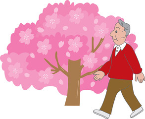 桜並木を歩く男性
