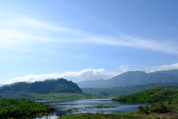 a portrait of a dried-up lake at the end of the village 