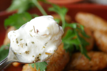 fresh yogurt on a spoon closeup 