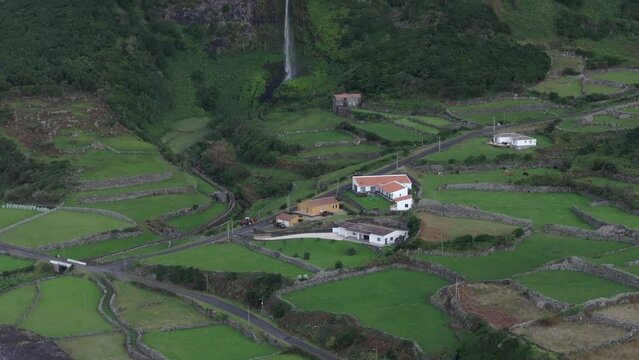 Wide view of cascata do poco do bacalhau waterfall at Faj&atilde; Grande - Drone shot