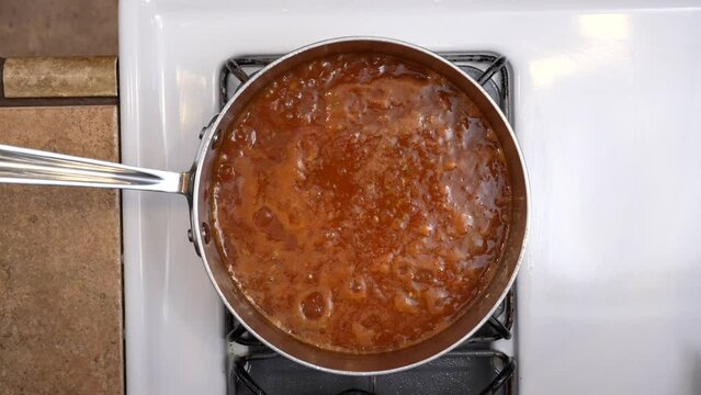 Top down down view of sauce simmering on the stove - chana masala series