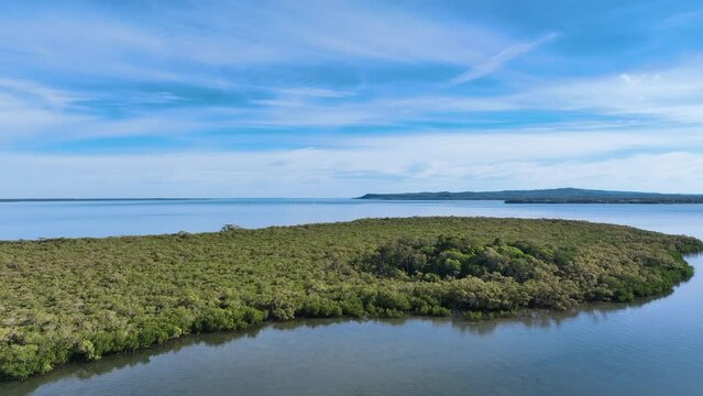 Descent to close up of lush Pannikin Island Fraser Cooloola Coast Australia