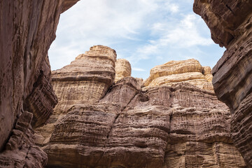 High  mountains along the edges of gorge along hiking route along Wadi Numeira gorge in Jordan