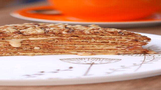  caramel cake and coffee cup on table 