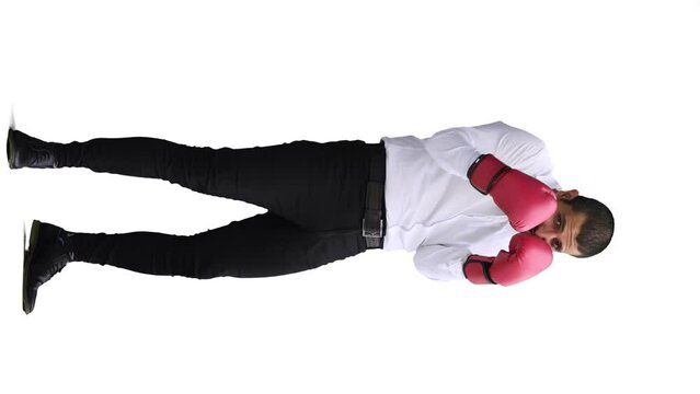 man in full growth. isolated on a white background in business clothes with boxing gloves