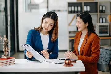 business people and lawyers discussing contract papers sitting at the table. Concepts of law, advice, legal services.
