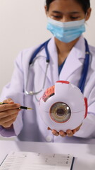 Initial AI illustration of a close-up of a female doctor's hand signing a medical document on a clipboard. and recommending certain medicines to patients on a laptop