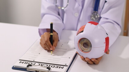 Initial AI illustration of a close-up of a female doctor's hand signing a medical document on a...