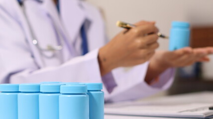 Initial AI illustration of a close-up of a female doctor's hand signing a medical document on a...