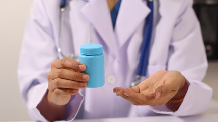 Initial AI illustration of a close-up of a female doctor's hand signing a medical document on a...