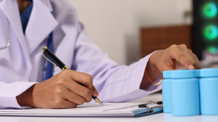 Initial AI illustration of a close-up of a female doctor's hand signing a medical document on a...