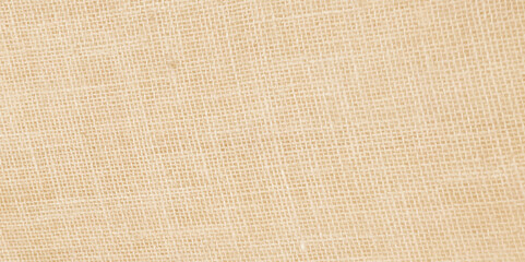Jute hessian sackcloth woven organic burlap, hemp flax texture pattern background in yellow beige cream brown color