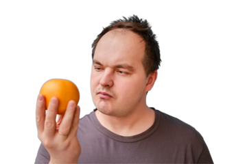 Portrait of a disheveled adult man with an orange fruit in his hand, isolated on a white background