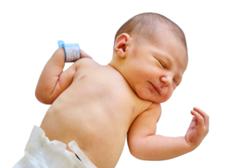 A newborn baby with a maternity hospital bracelet on his arm is sleeping in a crib, isolated on a white background. A newly born child in a clinic bed behind a transparent glass