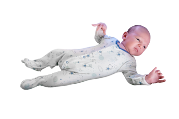 Portrait of a baby boy aged 1 month lying with his eyes open in a crib, isolated on a white background. Caucasian child in the children bedroom on the bed