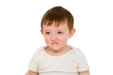 Offended baby looks pursed lips, studio, isolated on white background. Sad child with the emotion of resentment on his face. Kid about two years old (one year nine months)