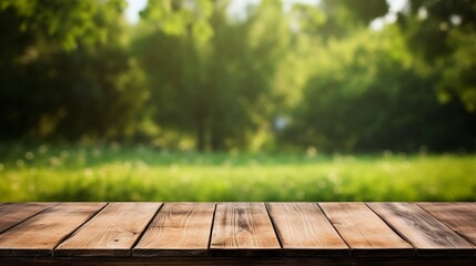 Empty wooden table on a background of green grass real photo
