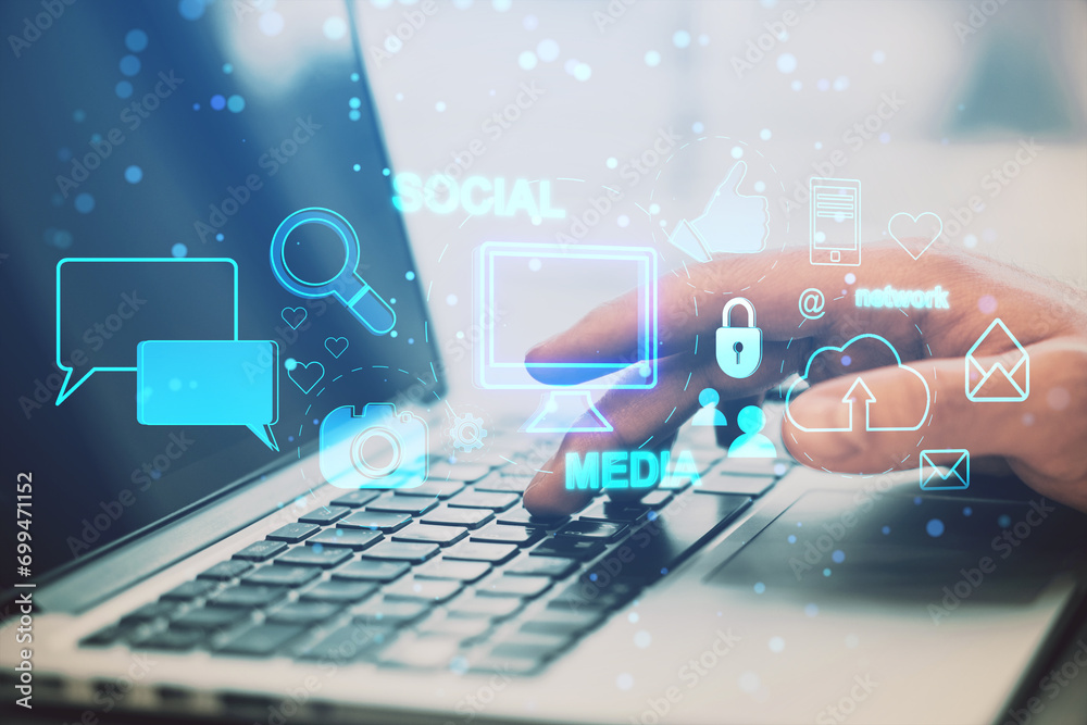 Poster close up of male hand using laptop on desk with creative social media interface with emails, speech 