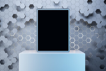 Close up of empty mock up tablet with creative gray hexagonal background. Device presentation...