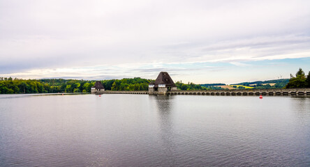 View of the Möhnesee and the dam and the surrounding landscape in the evening. Nature near Körbecke.
